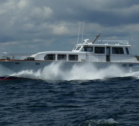 Motor yacht running through a heavy sea